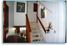 entry to living room, den, dining room and kitchen